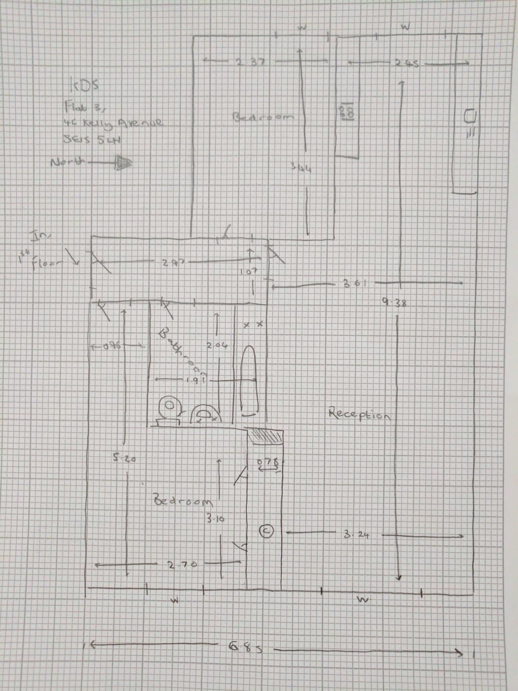 A hand-drawn floor plan sketch on graph paper